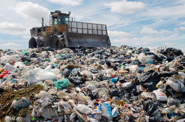 depositphotos_2403847-stock-photo-the-bulldozer-on-a-garbage